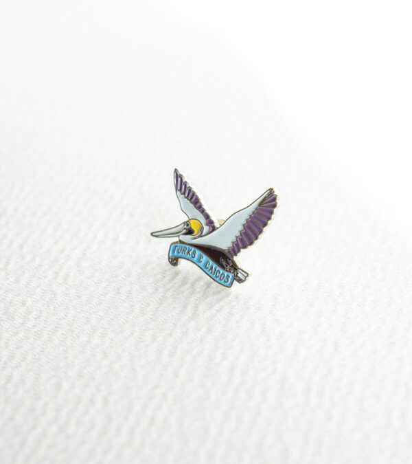 TCI brown pelican fly enamel lapel pin